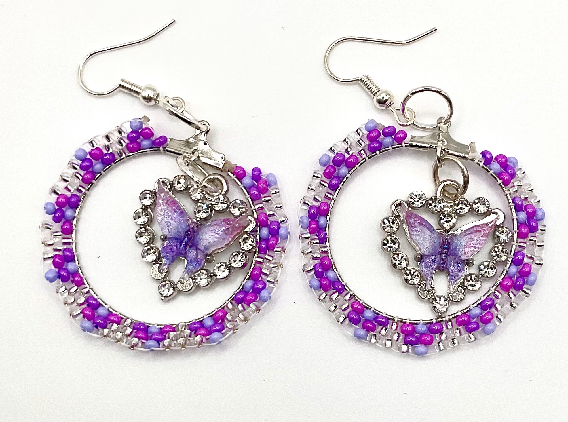 handcrafted purple butterfly hoop earrings — hypoallergenic hooks handcrafted purple butterfly hoop earrings — hypoallergenic hooks